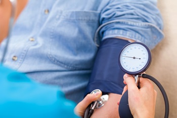 nurse measuring blood pressure