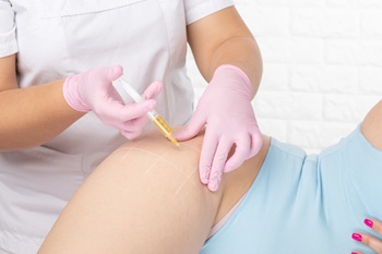 woman receiving hip injection